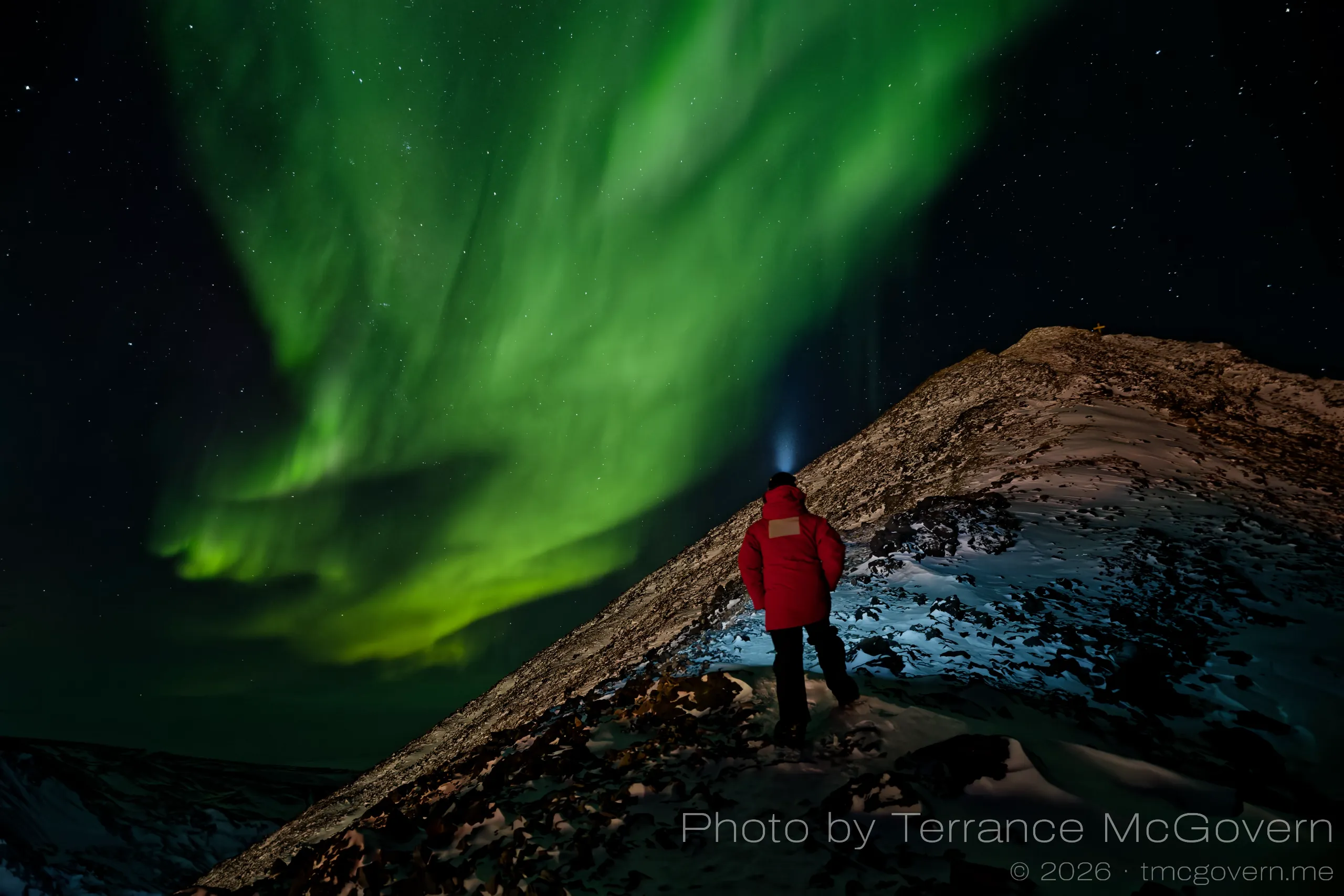 On the trail to the top of Observation Hill with strong auroras