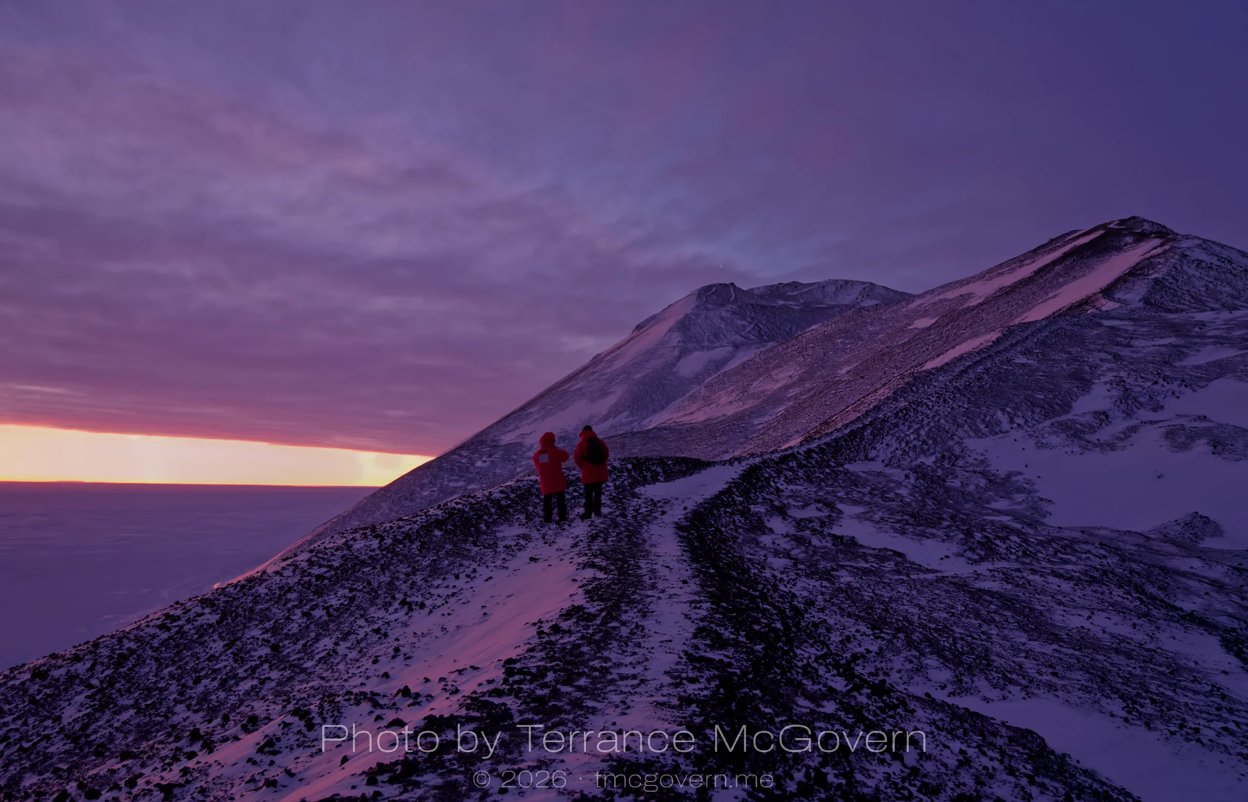 Two hikers admiring the light