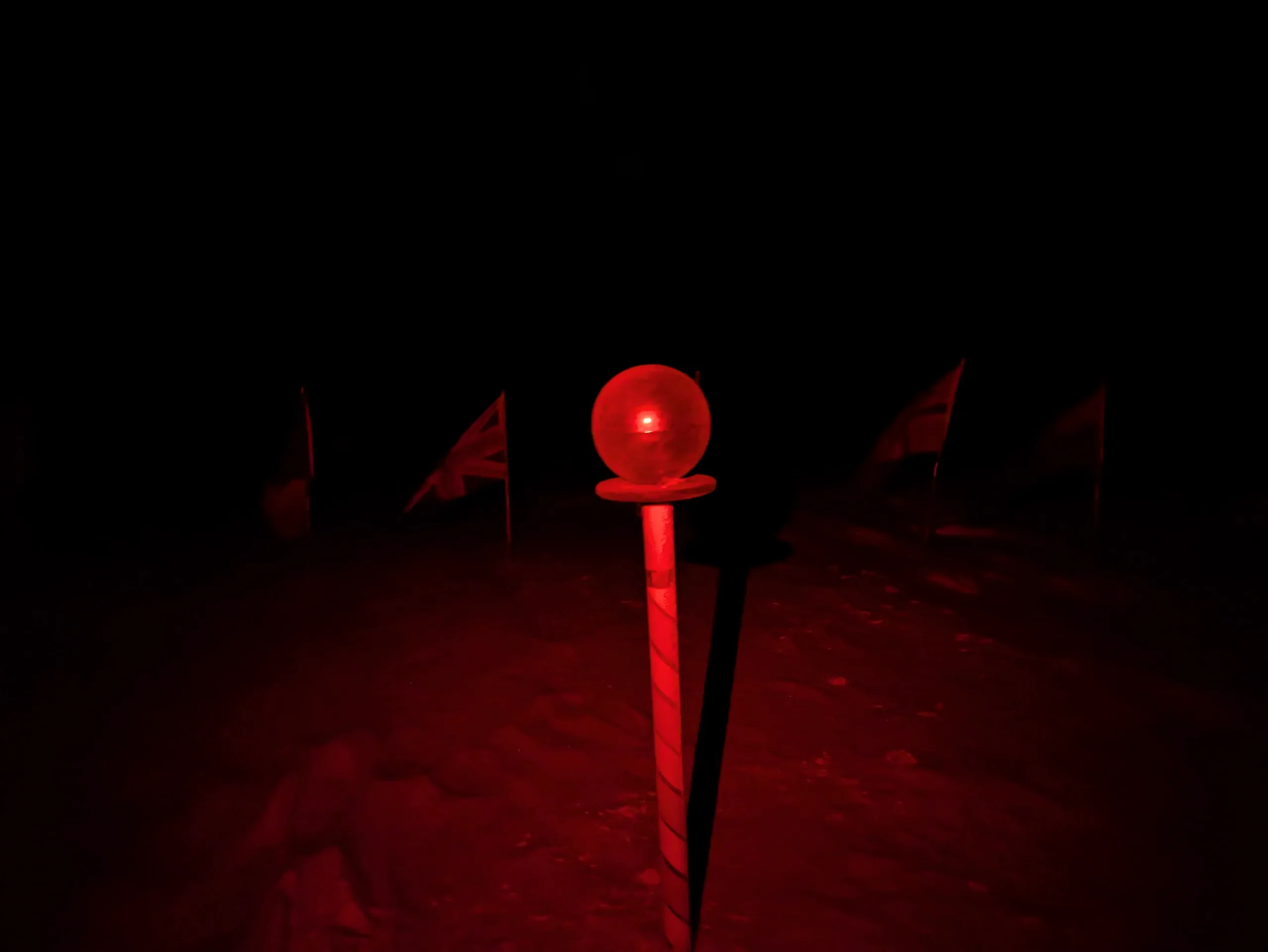 Eventually, true darkness sets in. Due to white-light sensitive science equipment, all lights used outside are red.